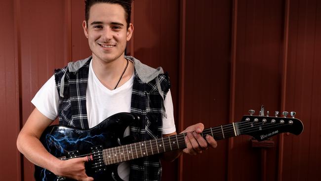 Coburg Teen With Seven Fingers Overcomes Bullying To Play Guitar Train