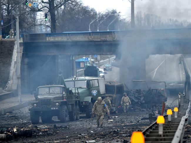 Ukrainian service members are seen at the site of a fighting with Russian raiding group in the Ukrainian capital of Kyiv. Picture: AFP