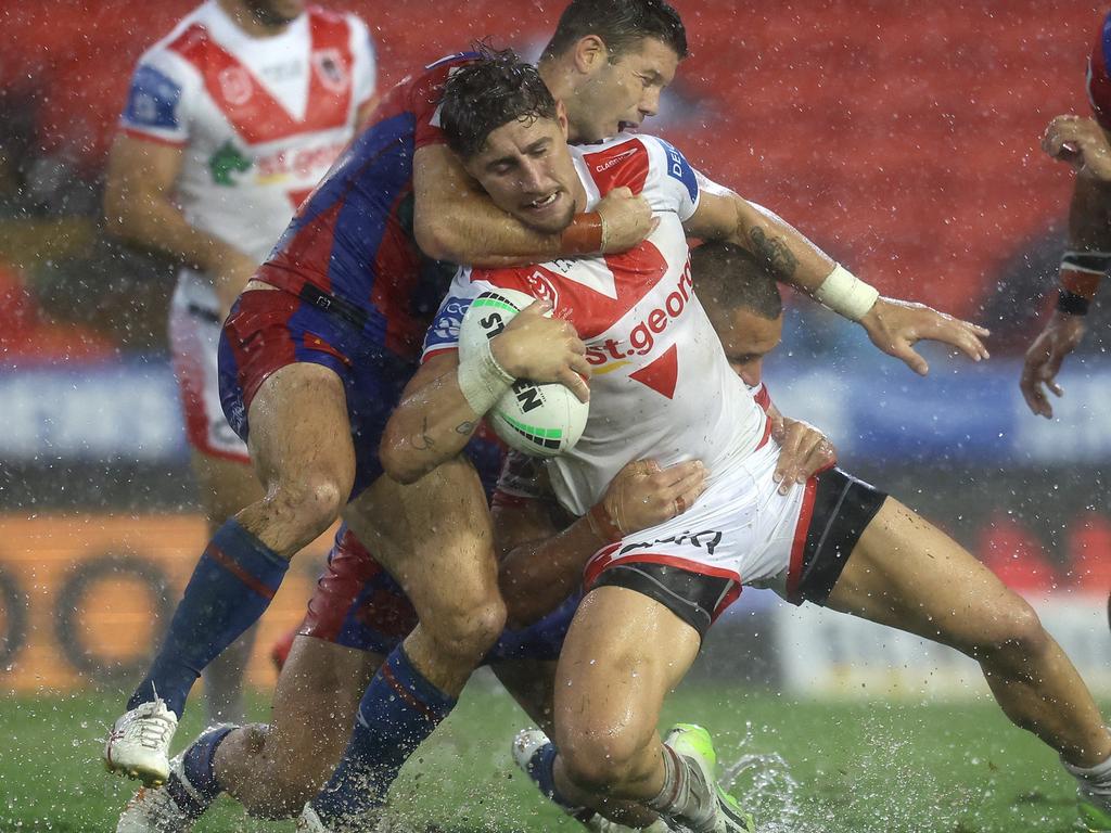 NEWCASTLE, AUSTRALIA – APRIL 05: Zac Lomax of the Dragonsis tackled during the round five NRL match between Newcastle Knights and St George Illawarra Dragons at McDonald Jones Stadium on April 05, 2024, in Newcastle, Australia. (Photo by Scott Gardiner/Getty Images)