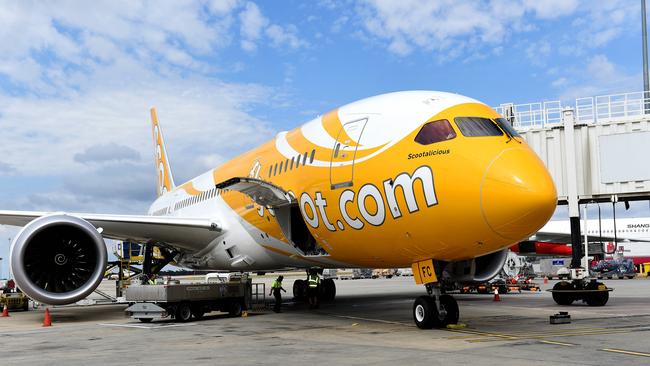 The flight was met at Sydney airport by AFP officers and an ambulance crew. Picture : Mike Keating.