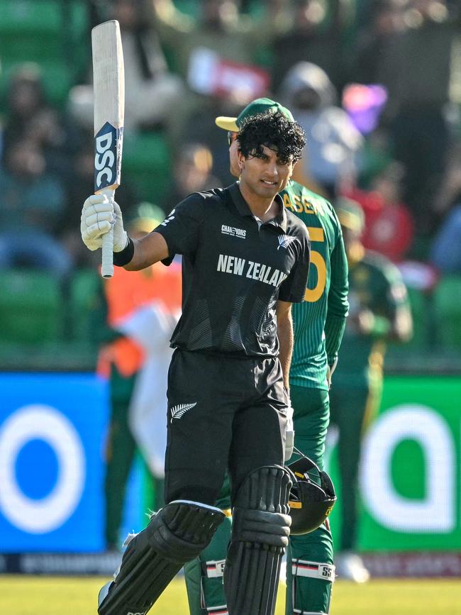 New Zealand's Rachin Ravindra celebrates after a scoring a century. (Photo by Asif HASSAN / AFP)