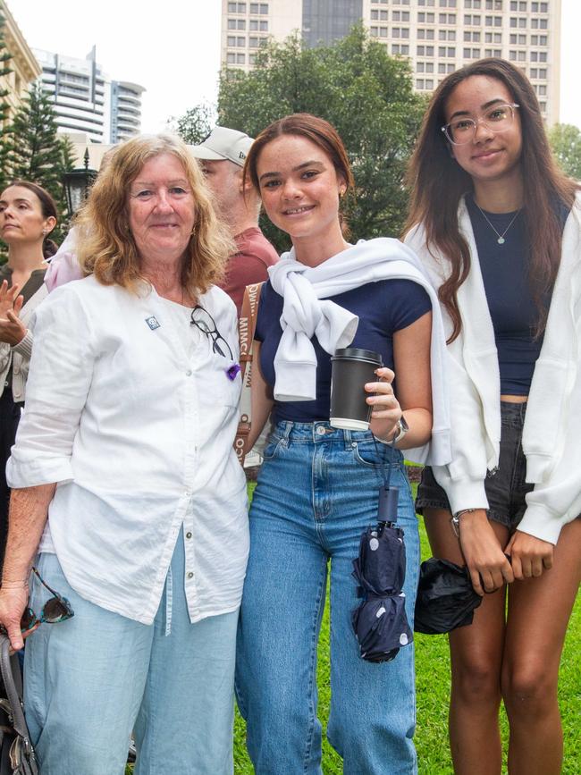 Thousands of people have braved the rain to gather in Brisbane for Anzac Day services. Picture: Grace Kessels
