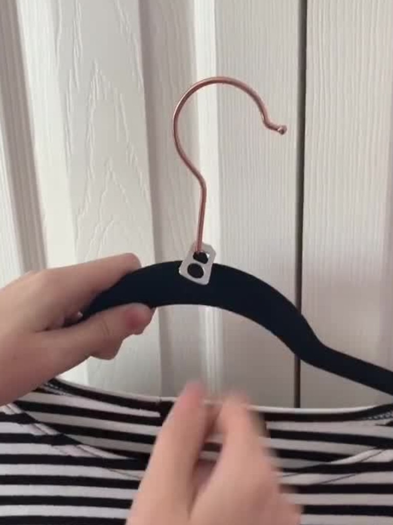 Slide the ring-pulls over the hook. Picture: tiktok/@hollyvlogsofficial