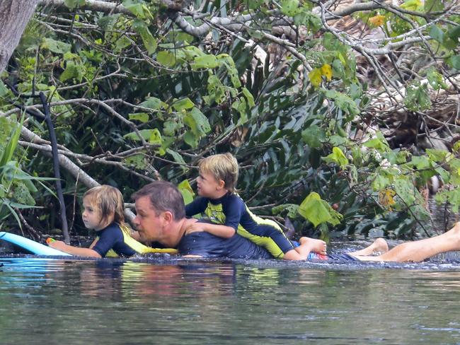 All aboard: His kids jumped on the board with their dad as they went exploring. Picture: MEDIA MODE/BACKGRID