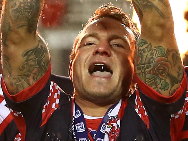 ST HELENS, ENGLAND - FEBRUARY 22: Jake Friend of Sydney Roosters lifts the Trophy after victory in the World Club Series Final between St Helens and Sydney Roosters at Totally Wicked Stadium on February 22, 2020 in St Helens, England. (Photo by Lewis Storey/Getty Images)