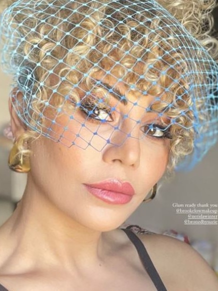 Fashion designer Lillian Khallouf has made a statement with a bright blue netted fascinator. Picture: Instagram/Lillian Khallouf