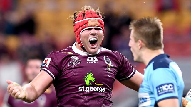 Harry Wilson celebrates scoring a try against the Waratahs at Suncorp Stadium