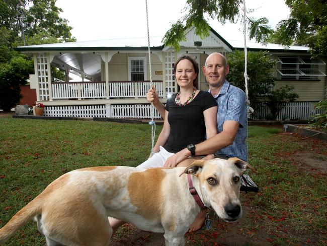 Kirstin and David Tobin with Avery the dog in front of their 1917-era home. Picture: AAP/Steve Pohlner