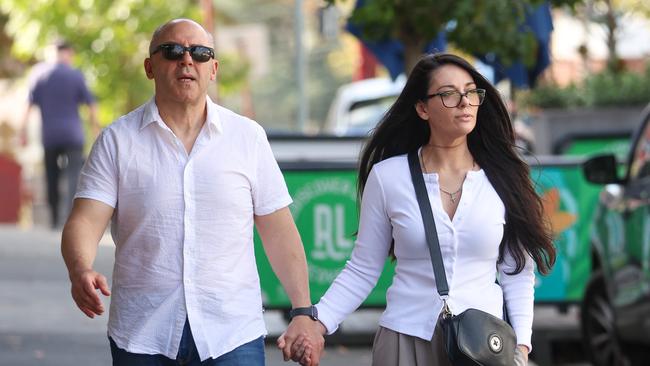 MELBOURNE, AUSTRALIA - APRIL 18 2025Tony Mokbel and his partner hold hands while walking down the street, stopping into a local bakery to get a coffee.Tony Mokbel spent his first Good Friday out of jail, first checking into a police station before trying to visit his local shopping centre which was closed, then walking down to a local bakery to get a coffee, holding hands with his partner as they walked down the street. They then stopped into a service station where Tony bought bottles of water and a copy of todayÃs Herald Sun before going to a Good Friday church service.After Church they went to Blu fish and chip shop for lunchPicture: Brendan Beckett