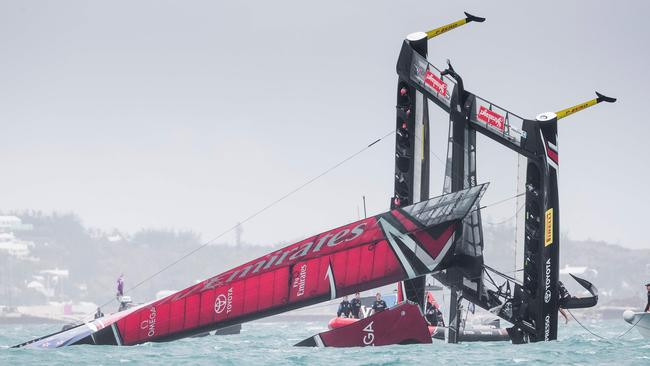 Emirates Team New Zealand is seen capsizing at the race start in race 5.