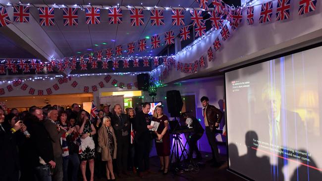 Revellers watch as British Prime Minister Boris Johnson addresses the nation at a Brexit Celebration party in Morley, northern England. Picture: AFP