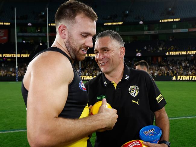 MELBOURNE, AUSTRALIA - APRIL 19: Noah Balta of the Tigers and Adem Yze, Senior Coach of the Tigers celebrates during the 2025 AFL Round 06 match between the Richmond Tigers and the Gold Coast Suns at Marvel Stadium on April 19, 2025 in Melbourne, Australia. (Photo by Michael Willson/AFL Photos via Getty Images)