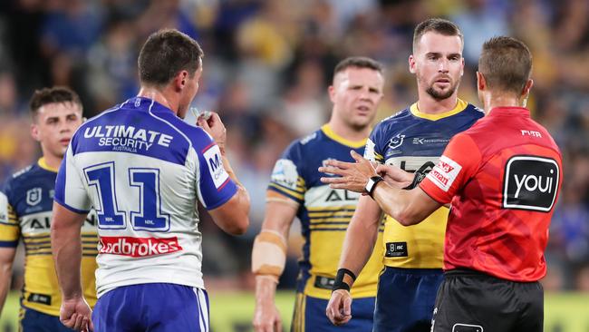 Josh Jackson and Clinton Gutherson speak to the referee after the first ever captain’s challenge. Picture: Matt King/Getty