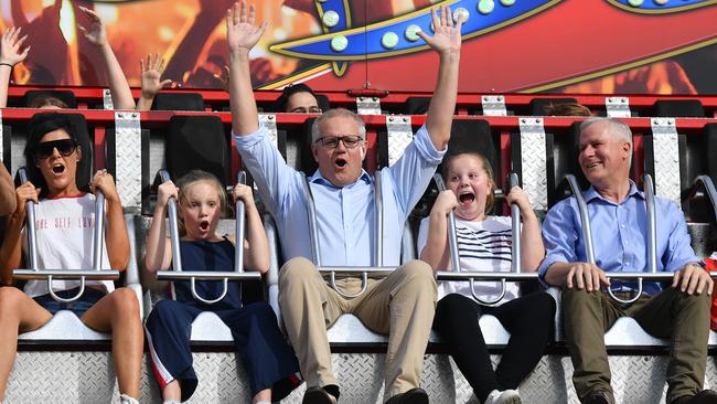 Morrison with daughters Lily and Abbey and Deputy PM Michael McCormack on the ‘Rock Star’ at the Easter Show. Picture: AAP    