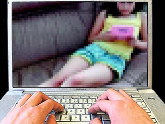 17/04/2009: 17/04/2009: child porn - generic of hands on computer laptop keybord with a photograph of a young child on the screen re: Child sex exploitation. Pic. Supplied MM318424 Pic. Supplied MM318424