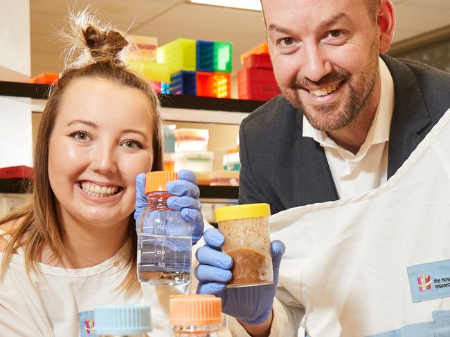 Patient Stephanee Hermsen with Dr. Sam Costello pose for a picture in the Biomebank lab at the The Hospital Research Foundation in Woodville South, where stools are stored and researched, Thursday, Feb. 22, 2018. (AAP Image/MATT LOXTON)