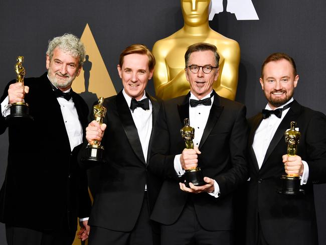 Sound mixers Peter Grace, Robert Mackenzie, Kevin O'Connell and Andy Wright with their Oscars for Sound Mixing for Hacksaw Ridge. Picture: Getty Images