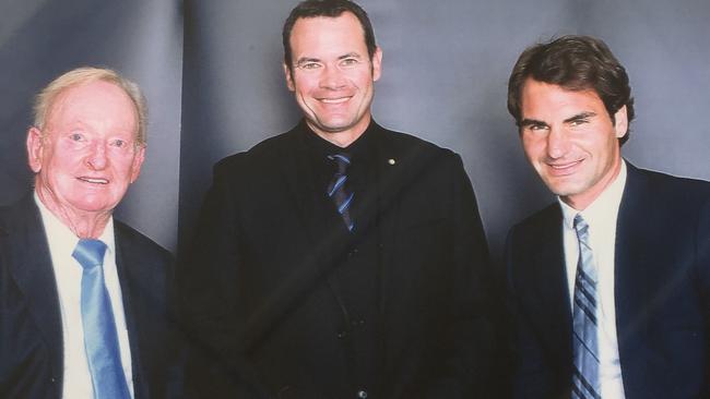The poet with tennis legends Rod Laver and Roger Federer.