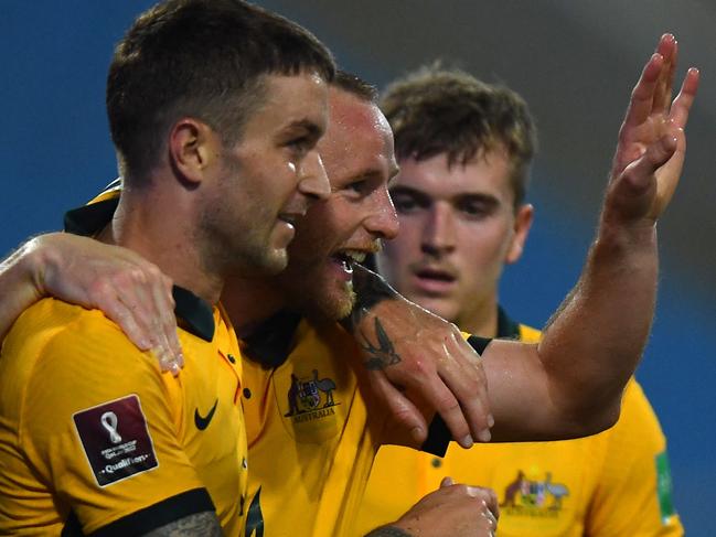Australia's defender Rhyan Grant (2nd L) reacts with teammates after scoring during the FIFA World Cup Qatar 2022 qualifying round Group B football match against Australia at the My Dinh National Stadium in Hanoi on September 7, 2021. (Photo by Manan VATSYAYANA / AFP)