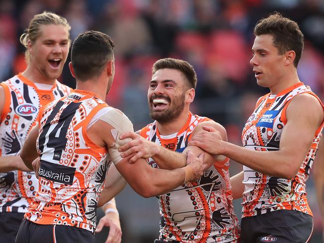 Giants Stephen Coniglio celebrates kicking a goal with teammates during AFL match between the GWS Giants and Gold Coast Suns at Giants Stadium. Picture. Phil Hillyard