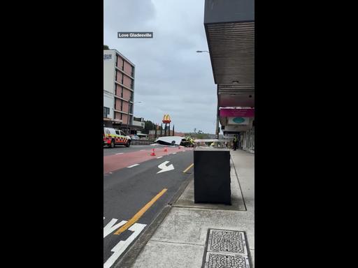 Wind blows roof off shop onto cars