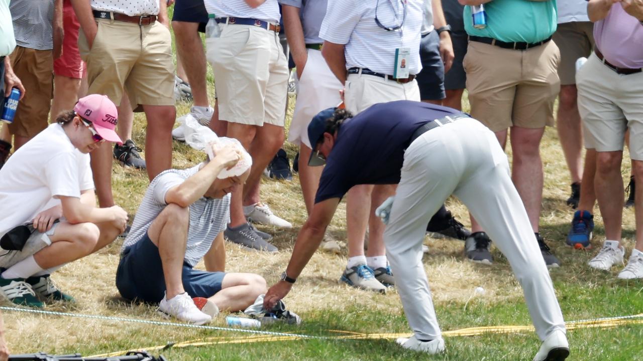 BROOKLINE, MASSACHUSETTS - JUNE 17: Phil Mickelson of the United States gives his golf glove to a fan that was hit by his errant drive off the third tee during the second round of the 122nd U.S. Open Championship at The Country Club on June 17, 2022 in Brookline, Massachusetts. (Photo by Rob Carr/Getty Images) *** BESTPIX ***