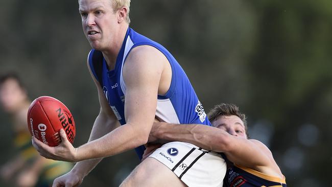 VAFA Footy: St Kevins v Mazenod. D.Kelly gets tackled.