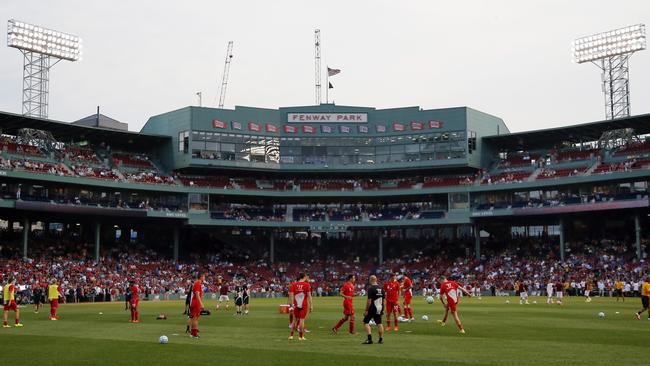 Liverpool FC players warm up prior to a friendly soccer match against AS Roma at Fenway Park.