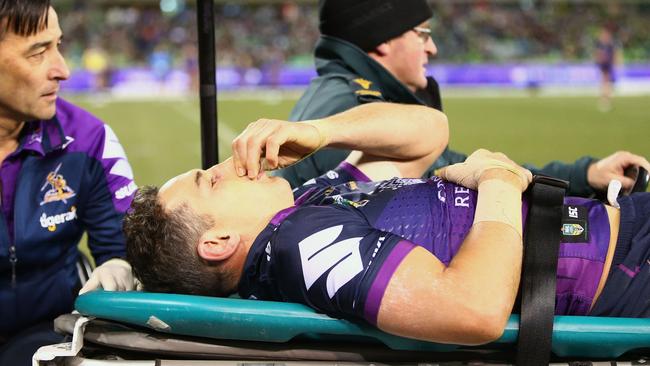 Melbourne Storm fullback Billy Slater is stretchered from the field after being knocked out on Saturday night.