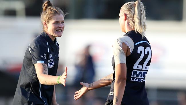 Injured Carlton skipper Brianna Davey talks to Tayla Harris pre-game. Picture: Michael Klein