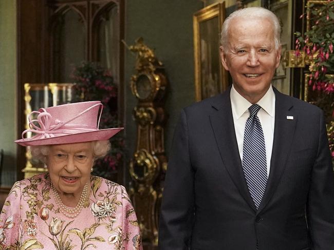 WINDSOR, ENGLAND - JUNE 13: Queen Elizabeth II with US President Joe Biden in the Grand Corridor during their visit to Windsor Castle on June 13, 2021 in Windsor, England. Queen Elizabeth II hosts US President, Joe Biden and First Lady Dr Jill Biden at Windsor Castle. The President arrived from Cornwall where he attended the G7 Leader's Summit and will travel on to Brussels for a meeting of NATO Allies and later in the week he will meet President of Russia, Vladimir Putin. (Photo by Steve Parsons - WPA Pool/Getty Images) *** BESTPIX ***