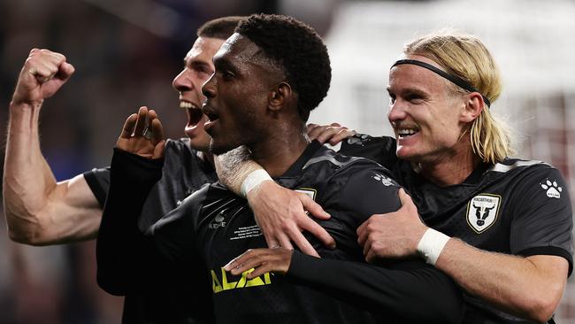 Al Hassan Toure celebrates with teammates after scoring a penalty for Macarthur FC in the Australia Cup final. Picture: Cameron Spencer/Getty Images