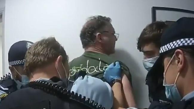 NSW Police handcuffed the former TV host in the hallway. Picture: Nine News