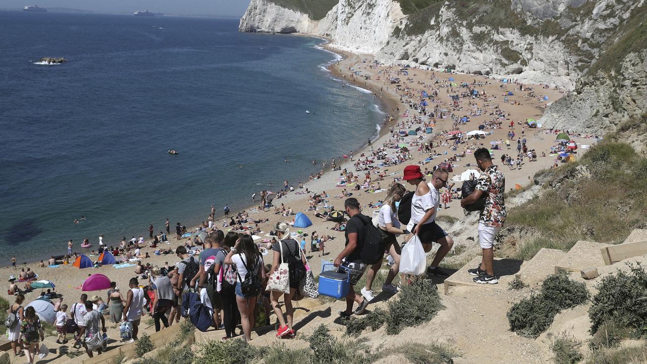 The beach at Durdle Door, near Lulworth in England on Saturday. Note the lack of social distancing. Picture: Andrew Matthews/PA via AP