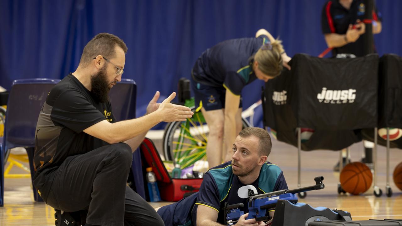 Invictus Games 2025 Team Australia competitor Callan McLean receives coaching on a biathlon laser rifle from Petty Officer Peter Sutton during a training camp held at the Australian Institute of Sport, Canberra, ACT.