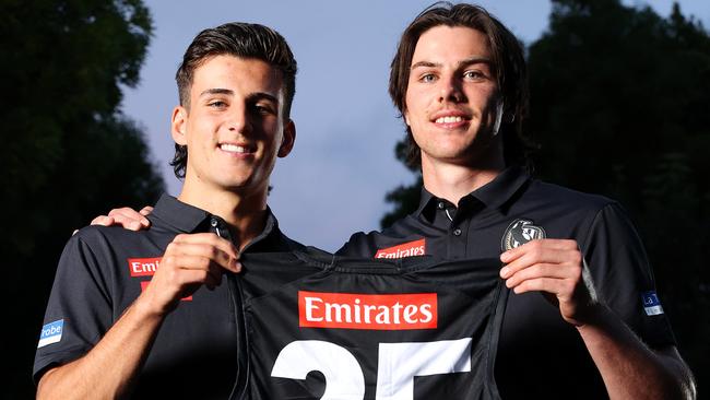 Oliver Henry presents Nick Daicos with his jumper. Picture: Mark Stewart