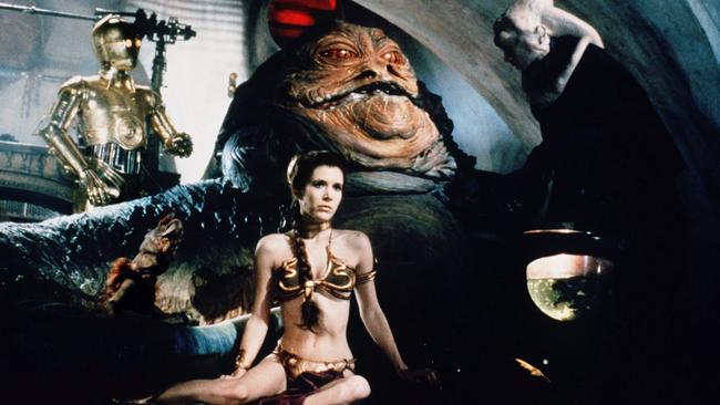 Carrie Fisher with C-3PO, Jabba the Hutt and Bib Fortuna in Return of the Jedi.