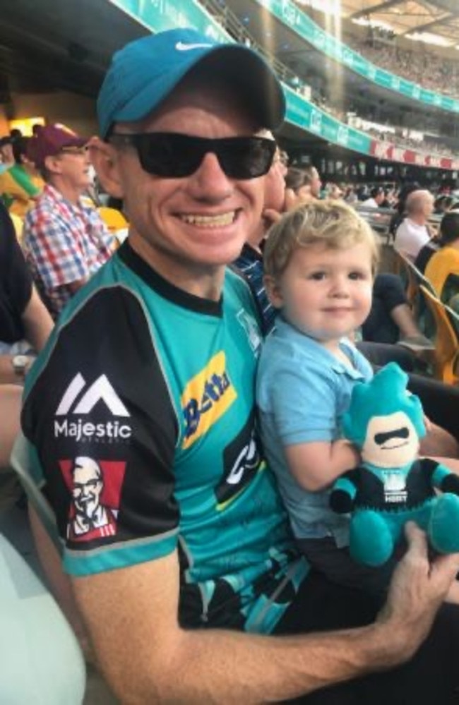 Spragg with son Owen, supporting the Brisbane Heat in the BBL