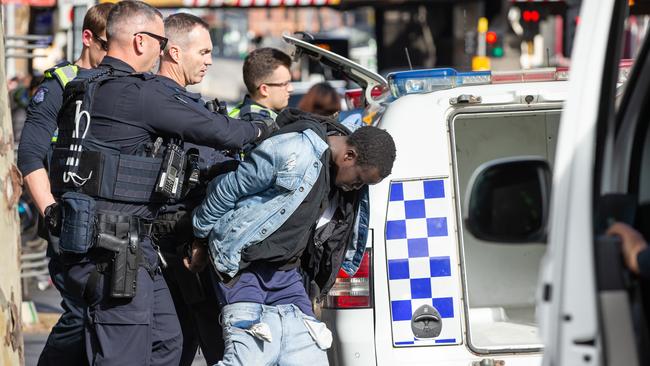 Police arrested five men on Spencer St. Picture: Sarah Matray