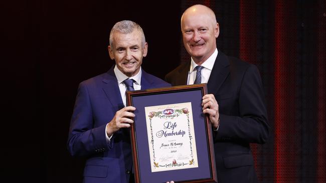 Chairman of the AFL Commission Richard Goyder (R) presents Bruce McAvaney Life Membership during the 2023 Toyota AFL Premiership Season Launch. Picture Getty Images