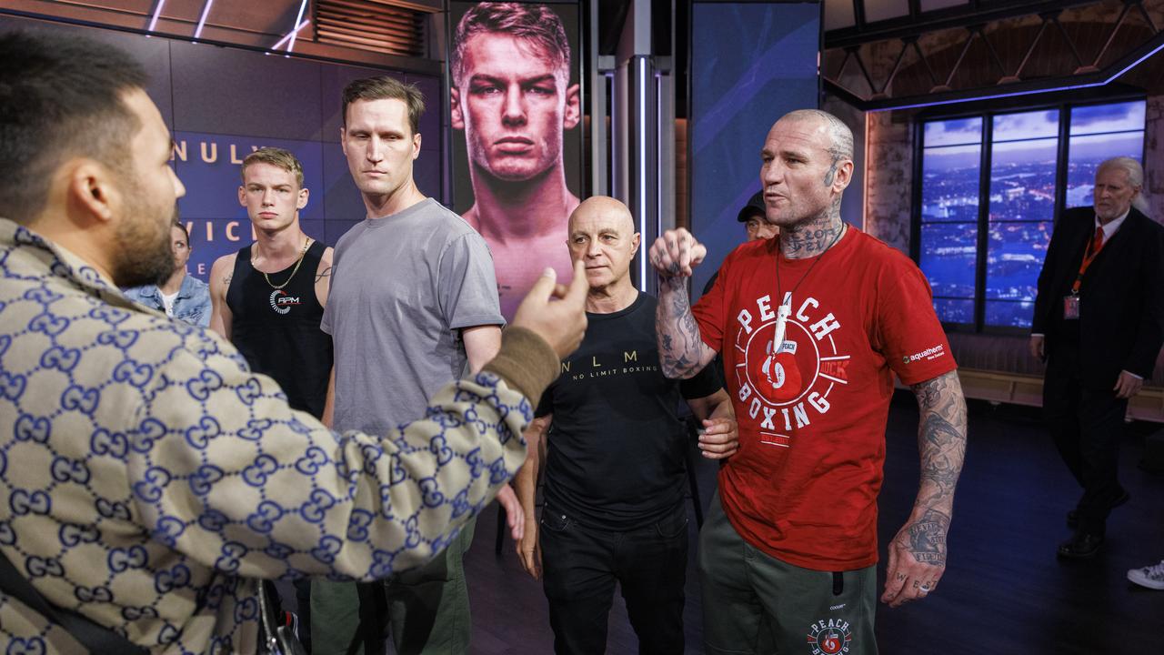 No Limit Boxing press conference at Fox Sports in Artarmon between Janibek Alimkhanuly and Andrei Mikhailovic ahead of their bout on Friday night, Wednesday 2nd October, 2024. Members of Andrei's team including coach Isaac Peach (red t-shirt) clash with members of Janibek's team including Berik Sultanov (back to camera). Picture: Toby Zerna