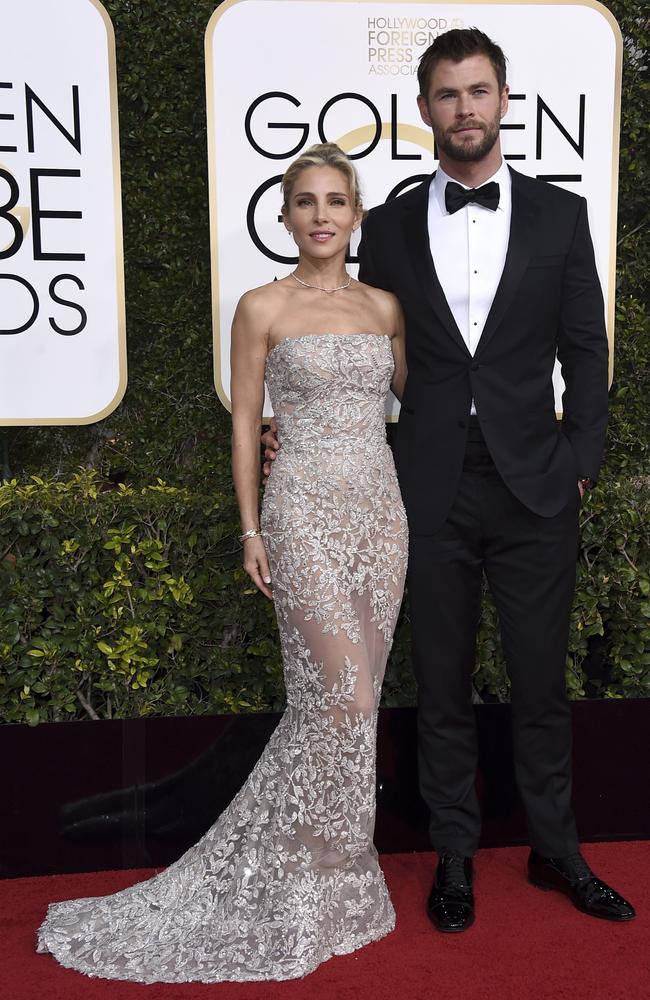 Elsa Pataky, left, and Chris Hemsworth arrive at the 74th annual Golden Globe Awards at the Beverly Hilton Hotel.