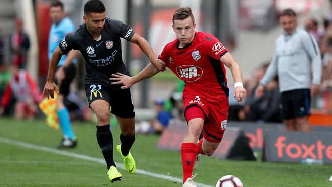 City’s Ramy Najjarine, left, takes on Adelaide’s Scott Galloway