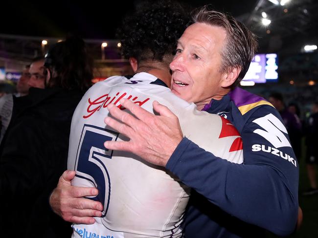 Storm coach Craig Bellamy and Josh Addo-Carr of the Storm embrace after winning the 2020 NRL Grand Final. Photo: Cameron Spencer/Getty Images.