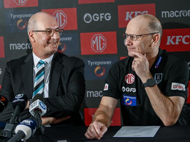 ADELAIDE, AUSTRALIA - FEBRUARY 12:Josh Carr senior assistant coach of Port Adelaide  ,Port Adelaide Football Club chairman David Koch and Ken Hinkley senior coach of Port Adelaide  speak to the media during a Port Adelaide Power AFL press conference at Alberton Oval on February 12, 2025 in Adelaide, Australia. (Photo by Mark Brake/Getty Images)