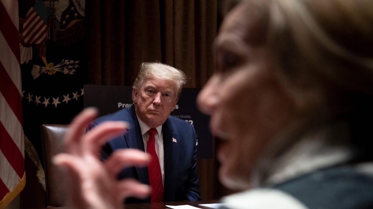 President Donald Trump listens to Response co-ordinator for White House Coronavirus Task Force Deborah Birx. Picture: Brendan Smialowski/AFP