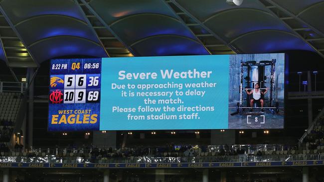 The match was able to recommence shortly before 9pm local time. (Photo by Will Russell/AFL Photos via Getty Images)