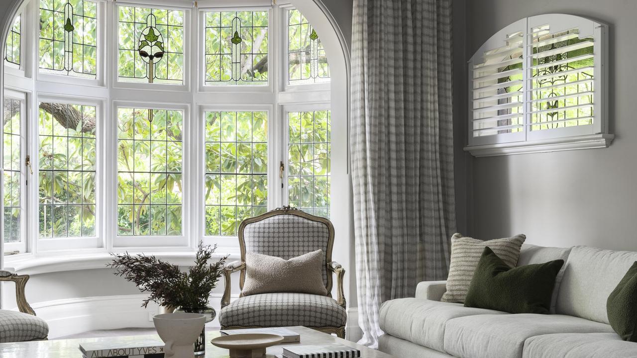 Heritage leadlight windows flood the home with natural light.