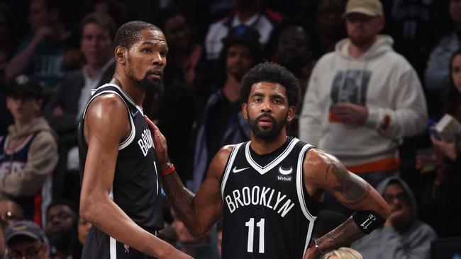 NEW YORK, NEW YORK - APRIL 23: Kevin Durant #7 and Kyrie Irving #11 of the Brooklyn Nets look on in the final seconds of their 109-103 loss against the Boston Celtics during Game Three of the Eastern Conference First Round NBA Playoffs at Barclays Center on April 23, 2022 in New York City. NOTE TO USER: User expressly acknowledges and agrees that, by downloading and or using this photograph, User is consenting to the terms and conditions of the Getty Images License Agreement.   Al Bello/Getty Images/AFP. == FOR NEWSPAPERS, INTERNET, TELCOS & TELEVISION USE ONLY ==