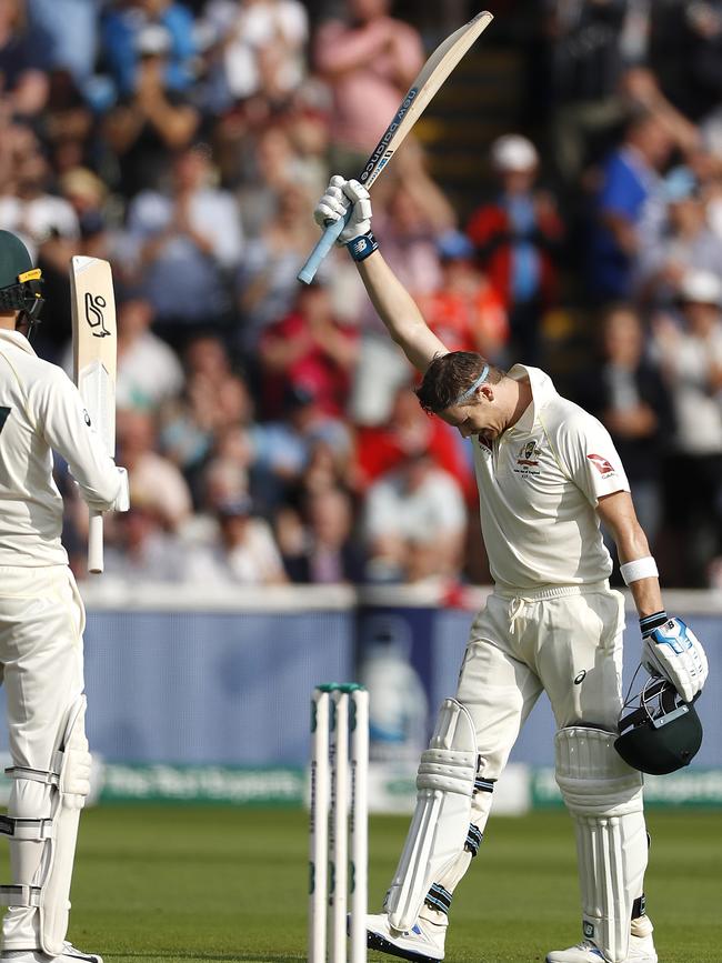 Steve Smith is congratulated by Nathan Lyon after reaching his century.